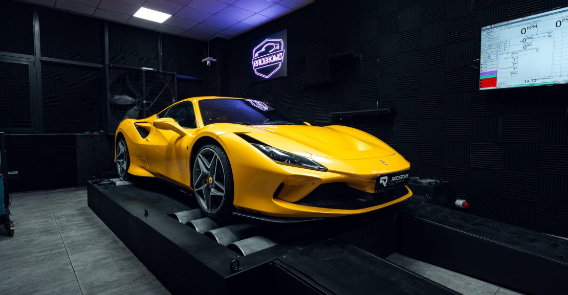 Yellow Ferrari on a dyno during a horsepower measurement